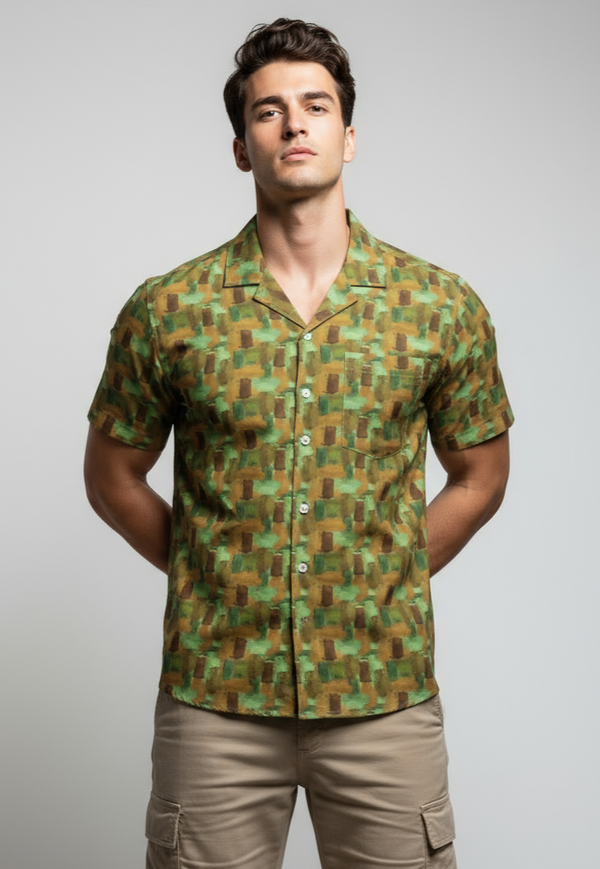 Man wearing a patterned shirt with geometric design on a plain background