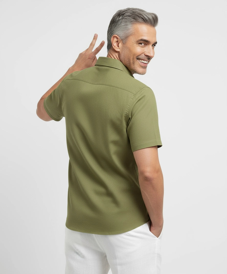 Man wearing light green olive men short-sleeve shirt. Spread Collar.