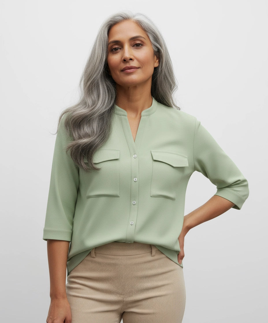 Woman wearing a Pista Light green shirt form women with two pockets, three fourth sleeves and mandarin collar.