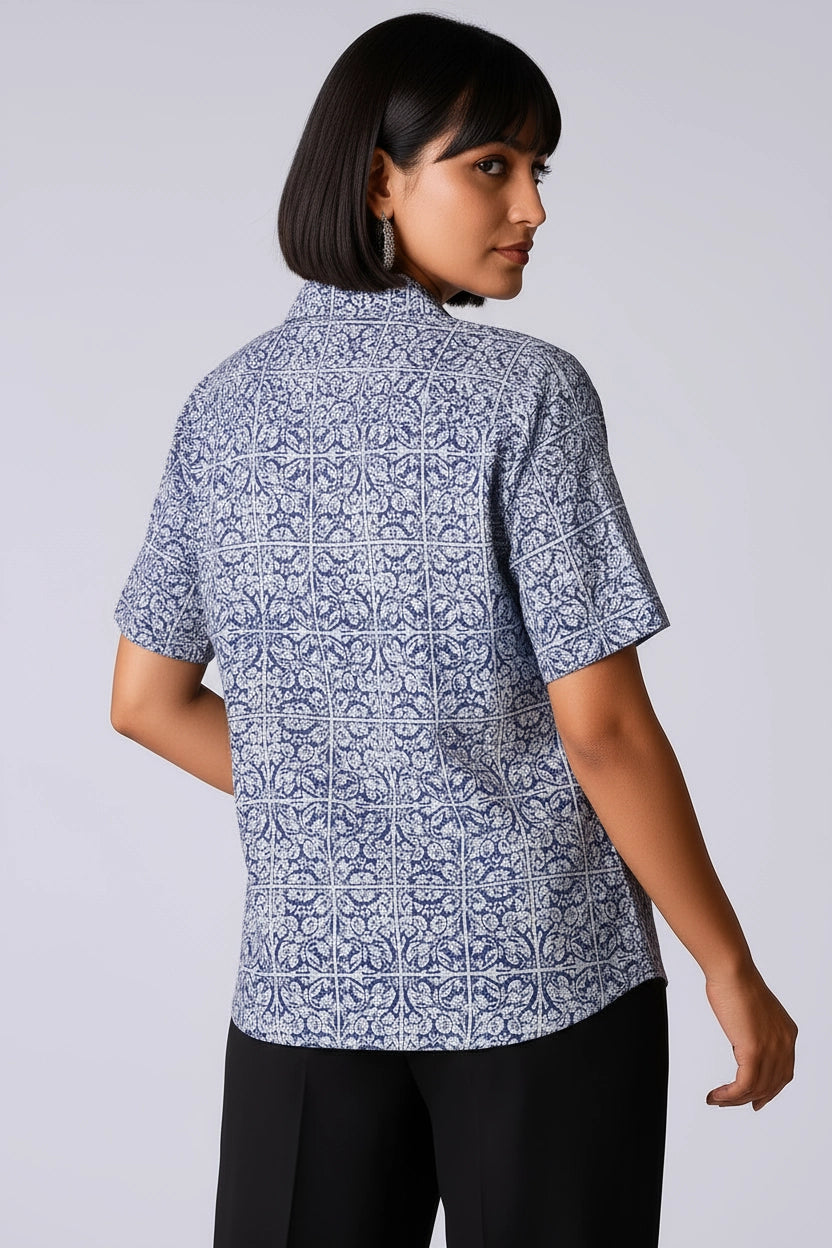 Short-sleeve women shirt with a blue floral and geometric pattern , cuban collar