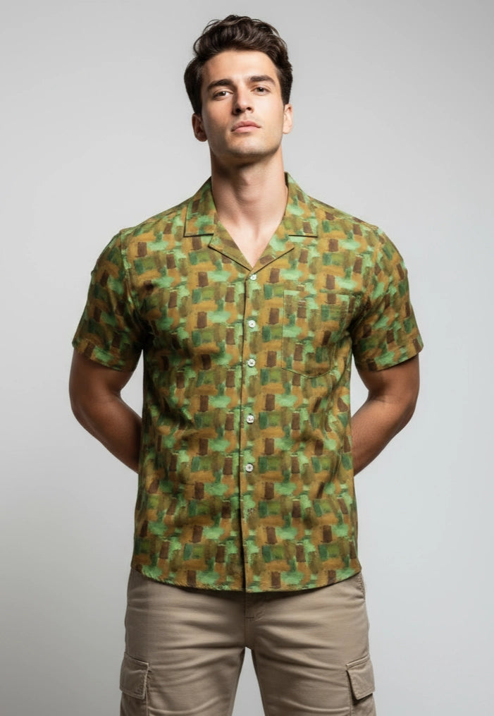 Man wearing a green geometric patterned shirt.