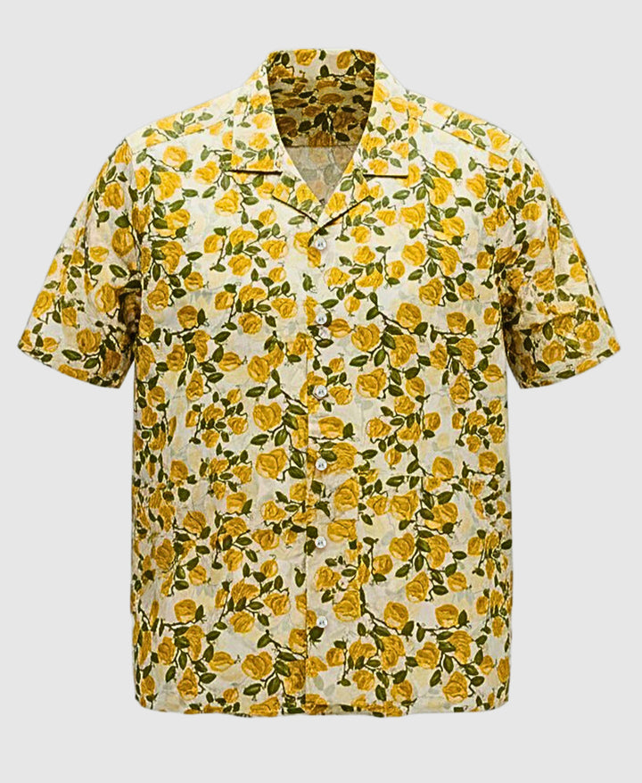 Short-sleeve shirt with yellow floral pattern on a white background