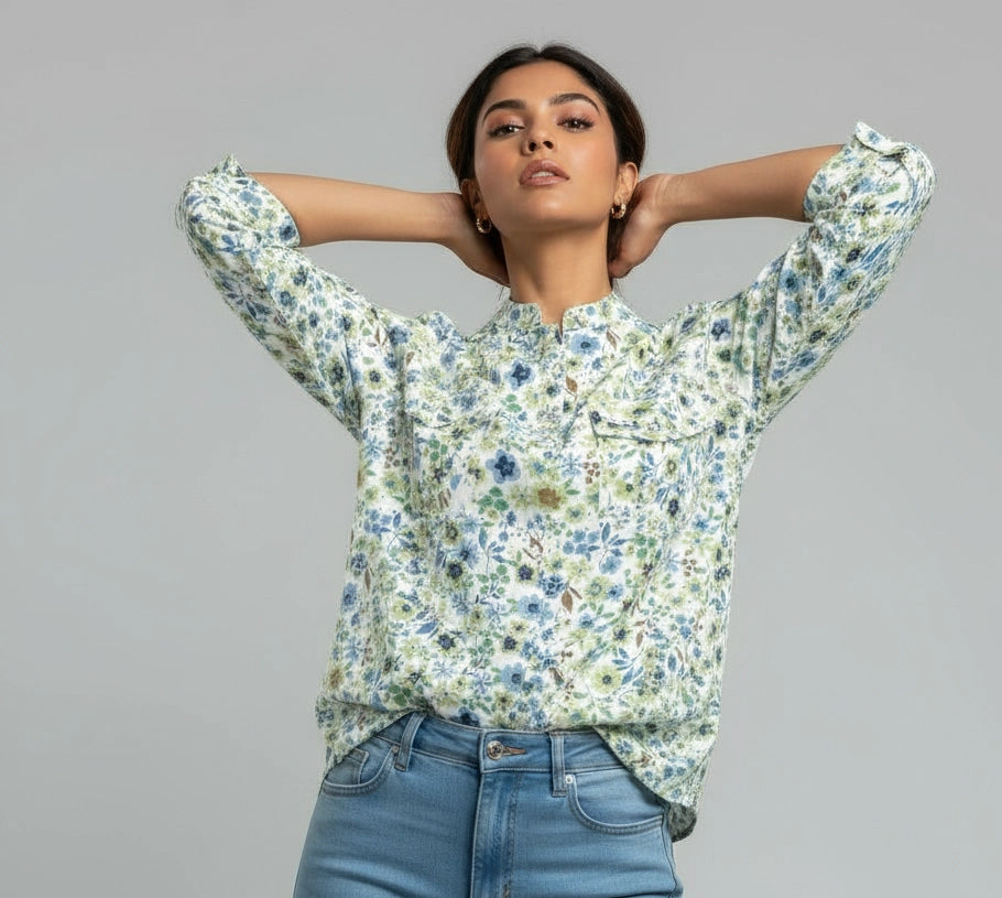 Woman wearing white blue and green floral women shirt, mandarin collar, three fourth sleeves