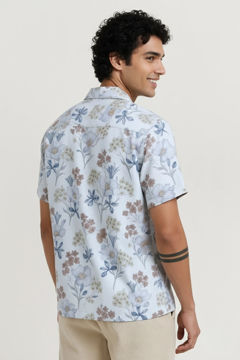 Man wearing a floral white short-sleeve shirt cuban collar