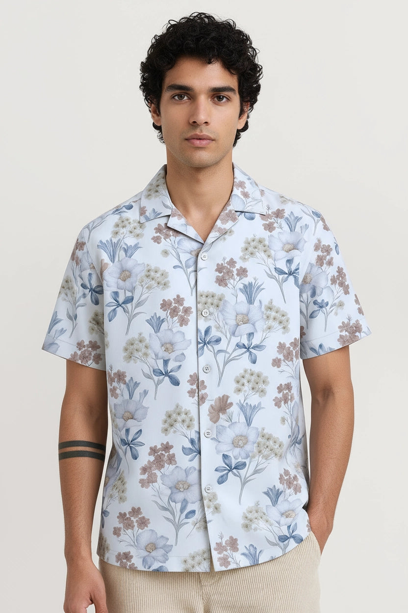Man wearing a floral white short-sleeve shirt cuban collar