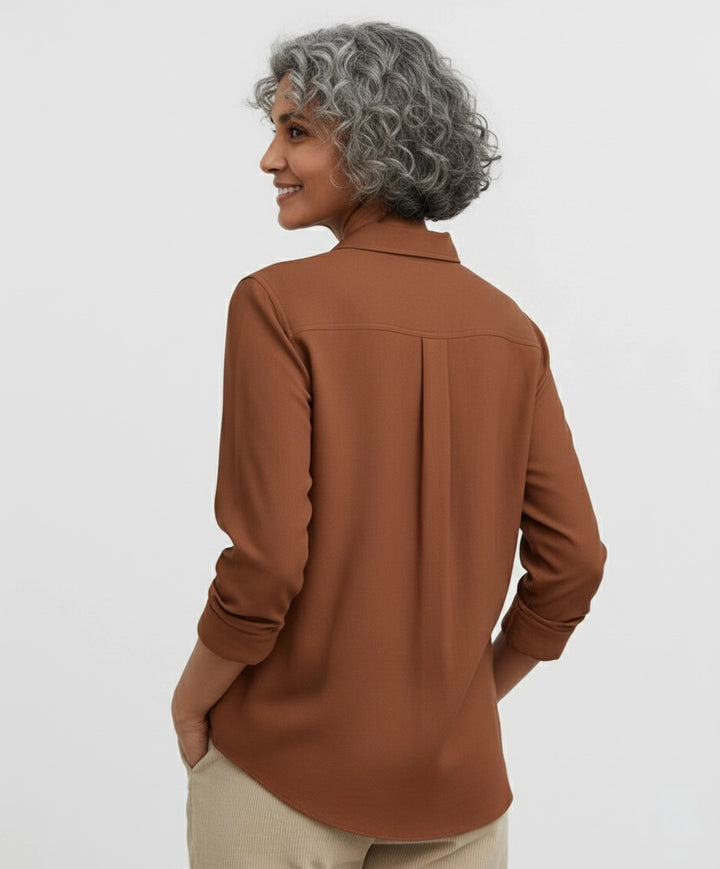 Woman wearing Rust brown, red, burgundy shirt for women with deep v neck and full sleeves. spread regular collar.