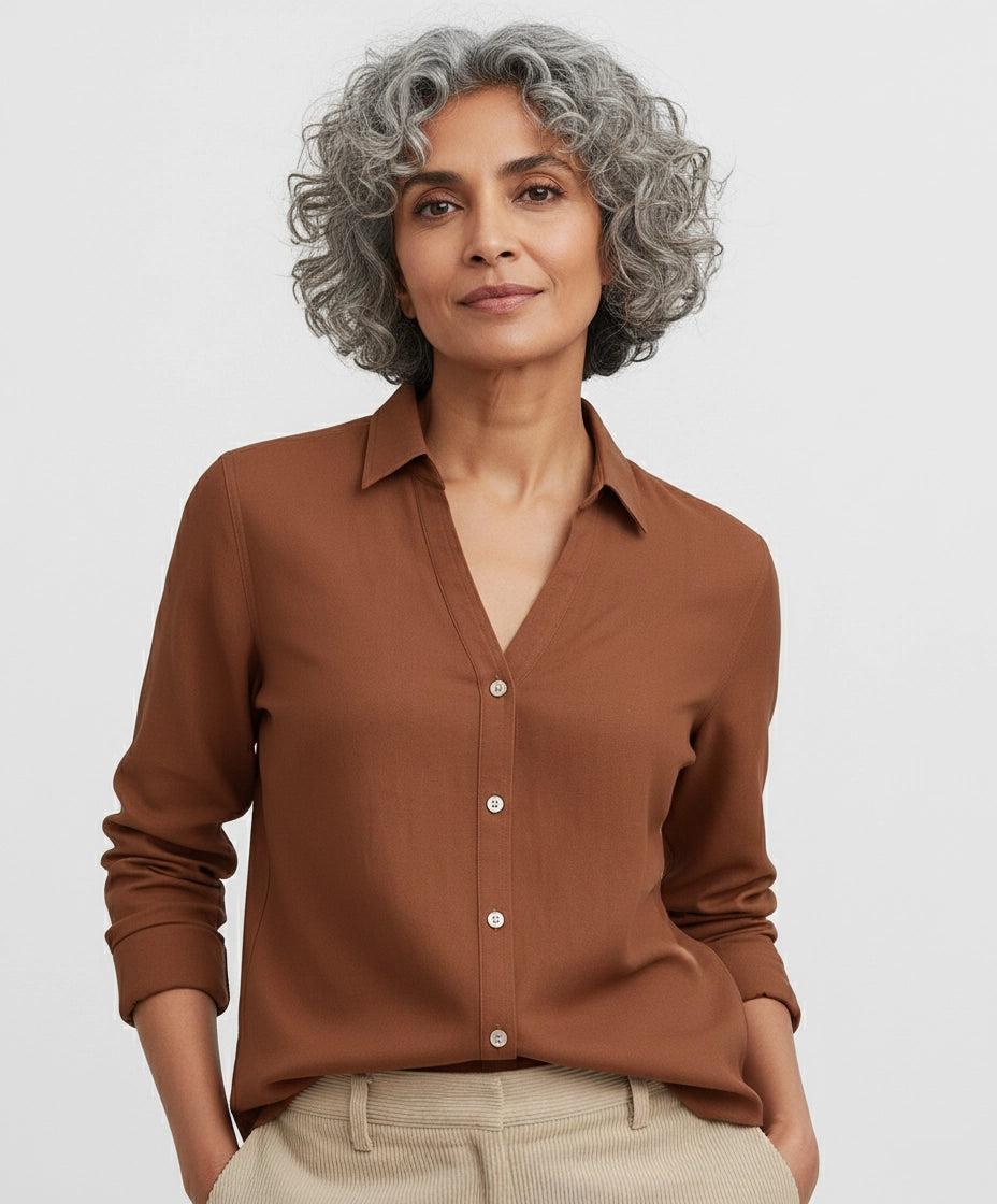 Woman wearing Rust brown, red, burgundy shirt for women with deep v neck and full sleeves. spread regular collar.