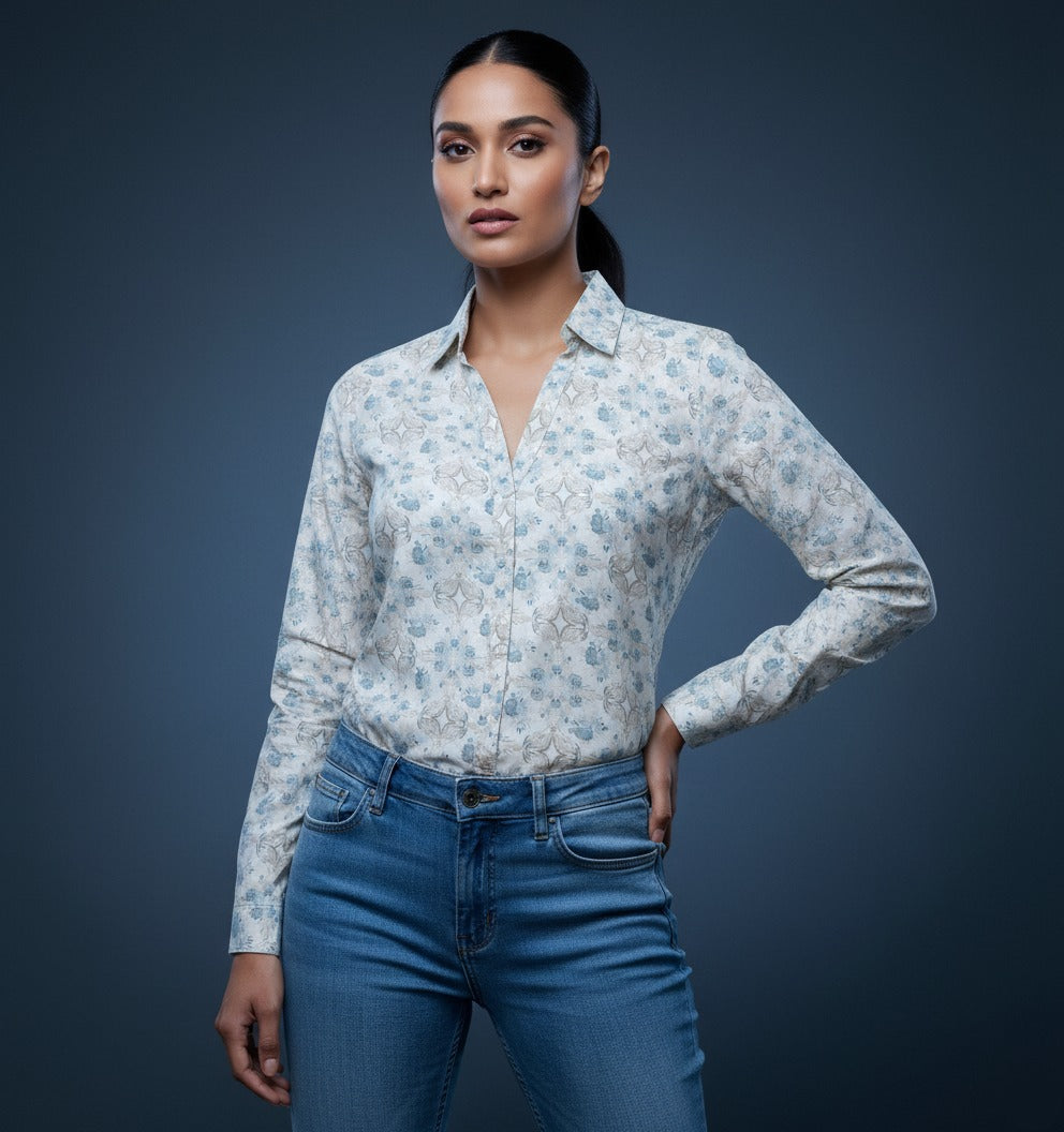 Women wearing a white and blue floral pattern women shirt , full sleeve, v neck.