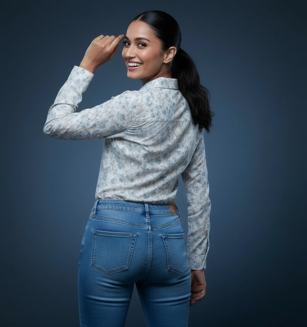 Woman wearing white and blue floral pattern women shirt , full sleeve, v neck.